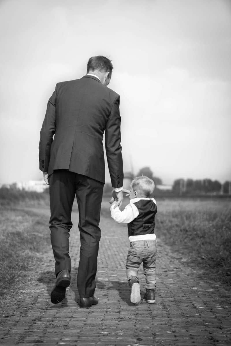 Man walking holding boy photo – Free Family Image on Unsplash