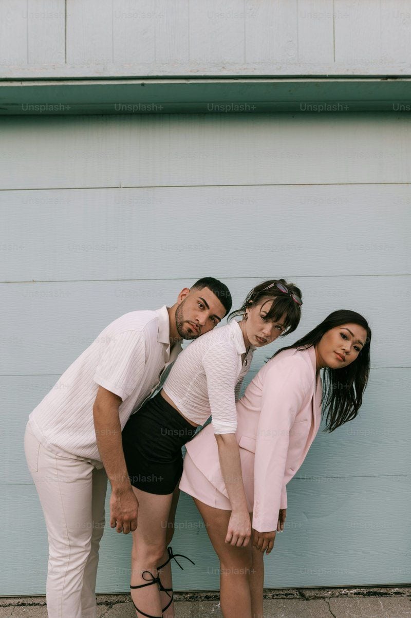 A man and two women standing next to each other photo – Style Image on Unsplash A man and two women standing next to each other photo – Style Image on Unsplash