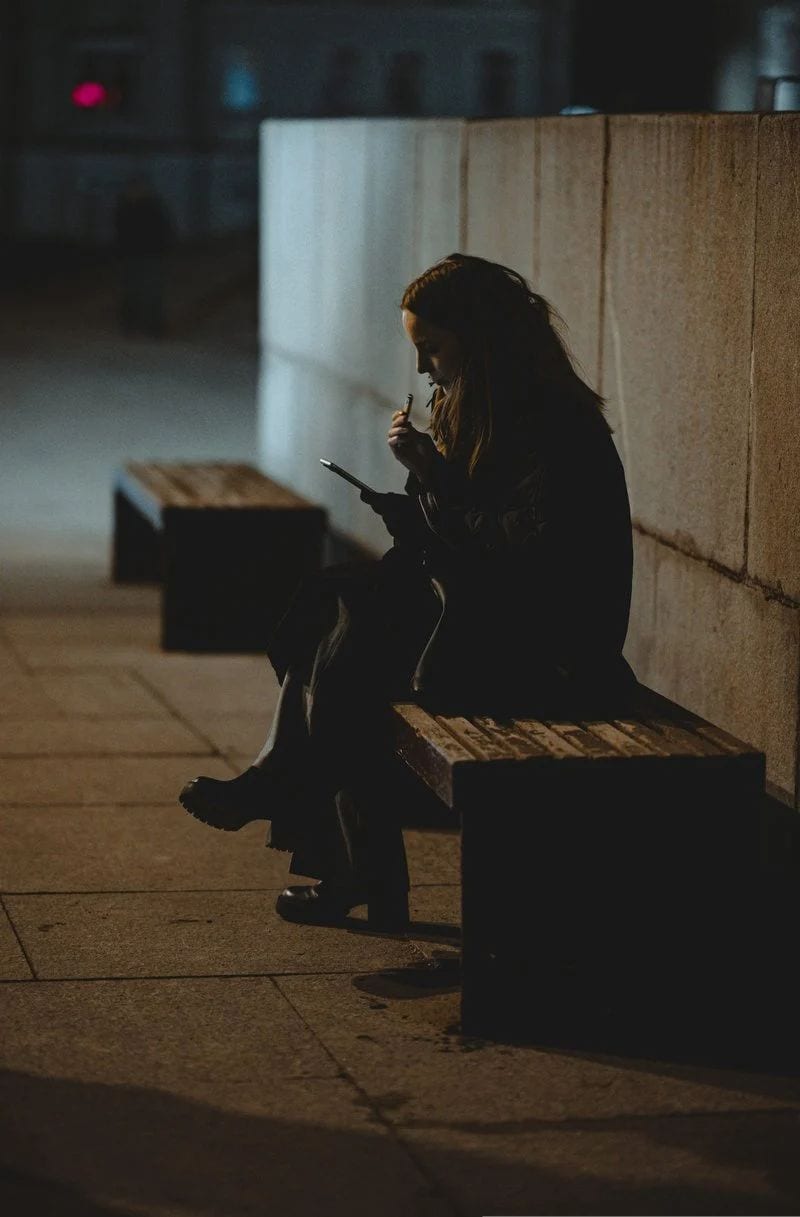 A woman checks her phone in a public space. photo – Free Blue Image on Unsplash A woman checks her phone in a public space. photo – Free Blue Image on Unsplash