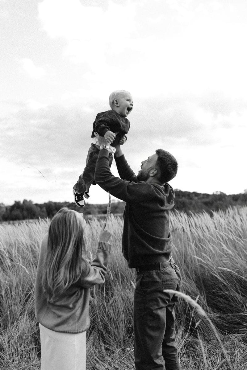 Father throws happy baby in the air photo – Free Portrait ...