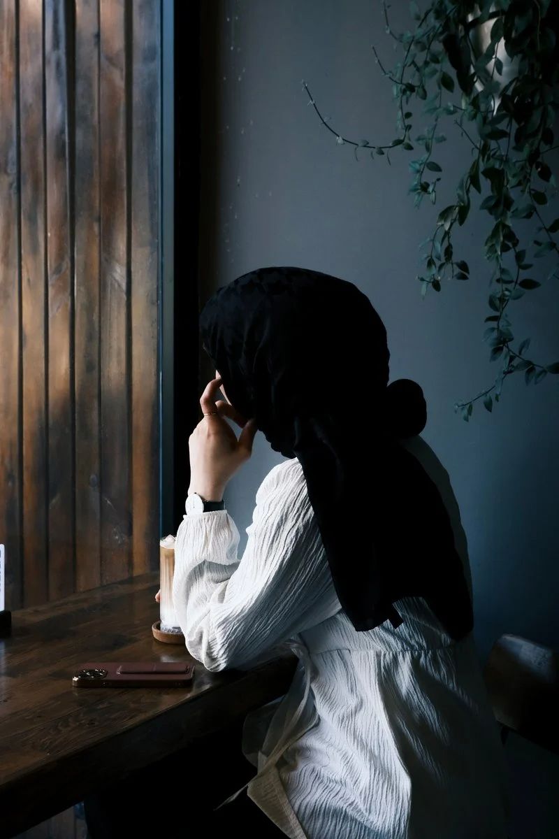 Woman Sitting Behind Desk Wearing Turban · Free Stock Photo