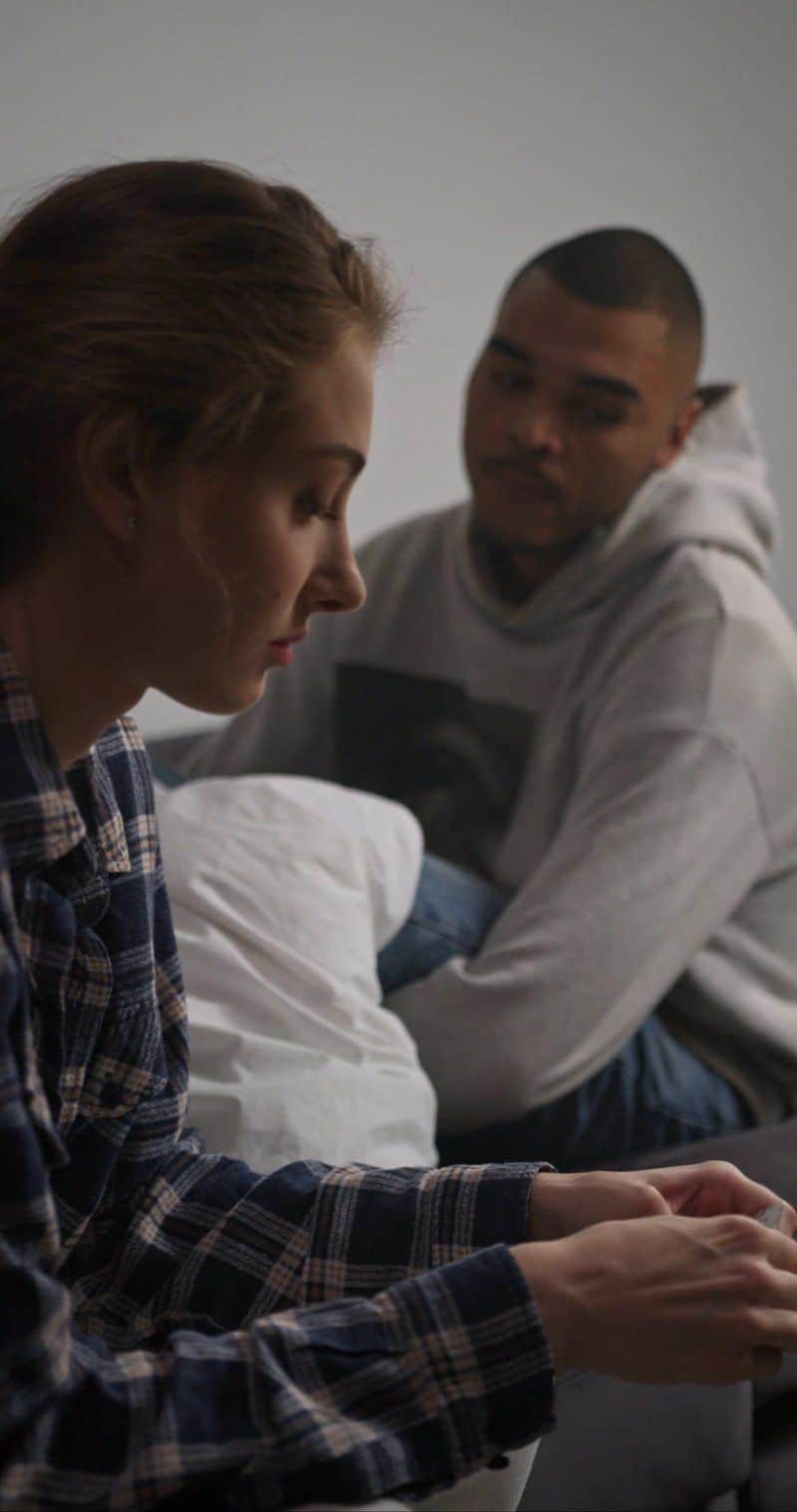 A Sad Couple Sitting in a Room A Sad Couple Sitting in a Room
