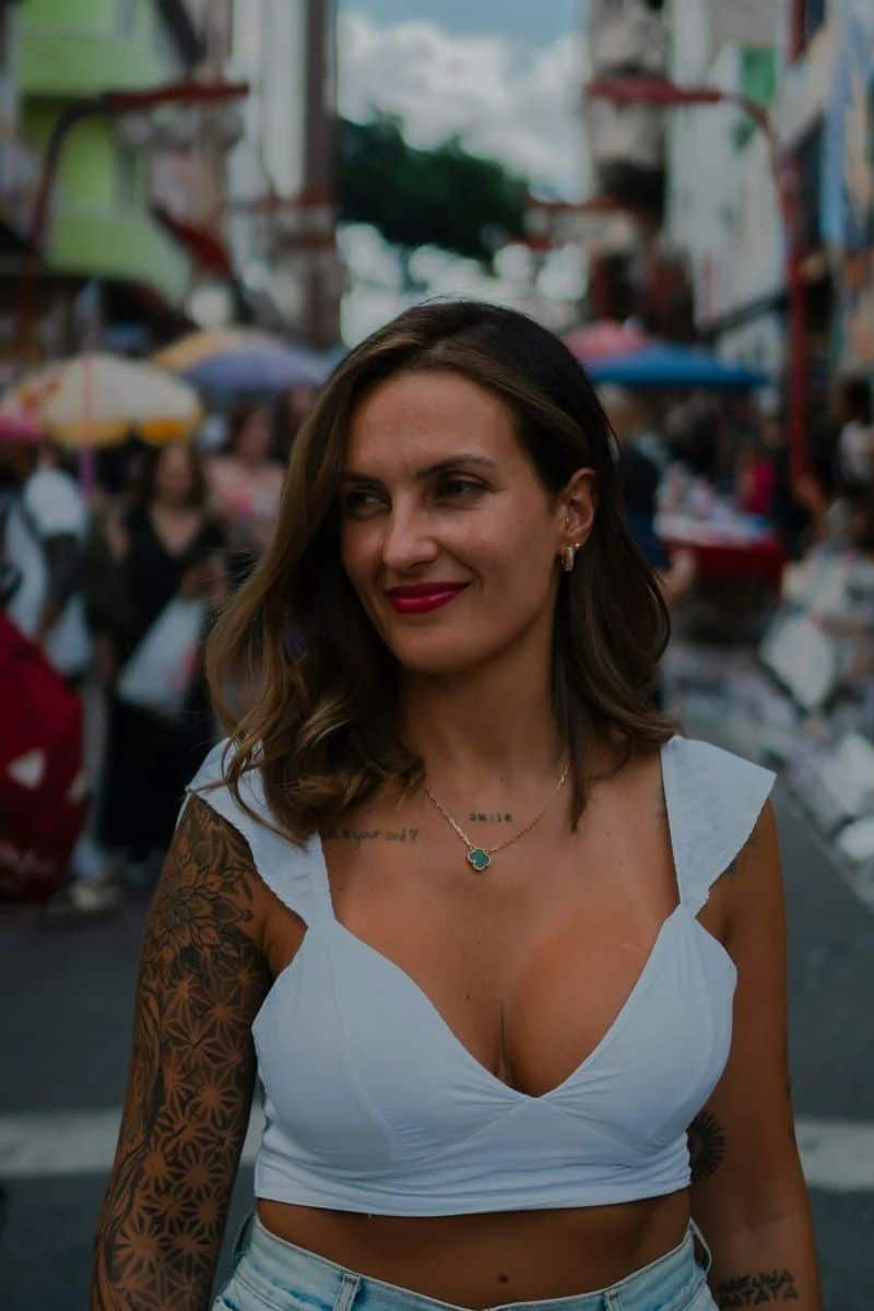 Woman with tattoos and red lipstick in a busy street photo – Free Necklace Image on Unsplash Woman with tattoos and red lipstick in a busy street photo – Free Necklace Image on Unsplash