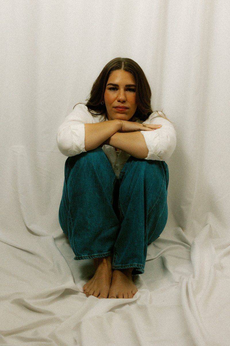 A sad woman sits alone with her arms crossed. photo – Free Purple Image on Unsplash A sad woman sits alone with her arms crossed. photo – Free Purple Image on Unsplash