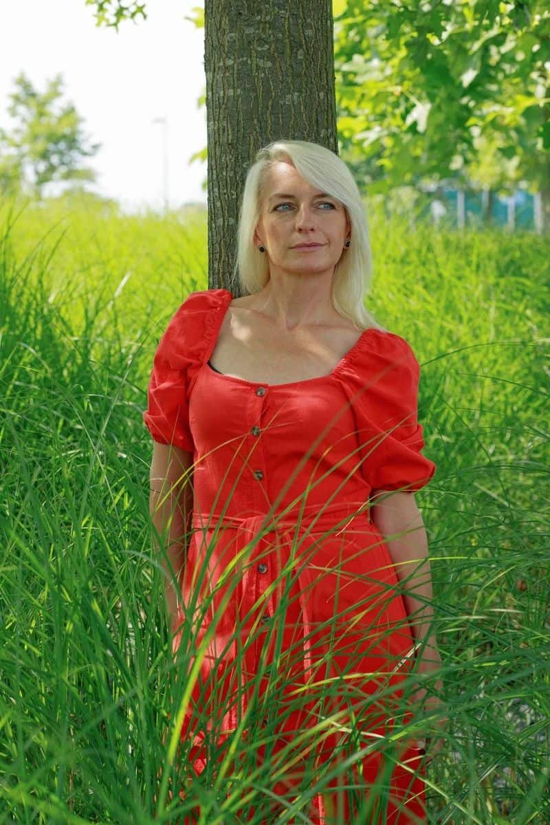Mature Woman Standing Under the Tree · Free Stock Photo