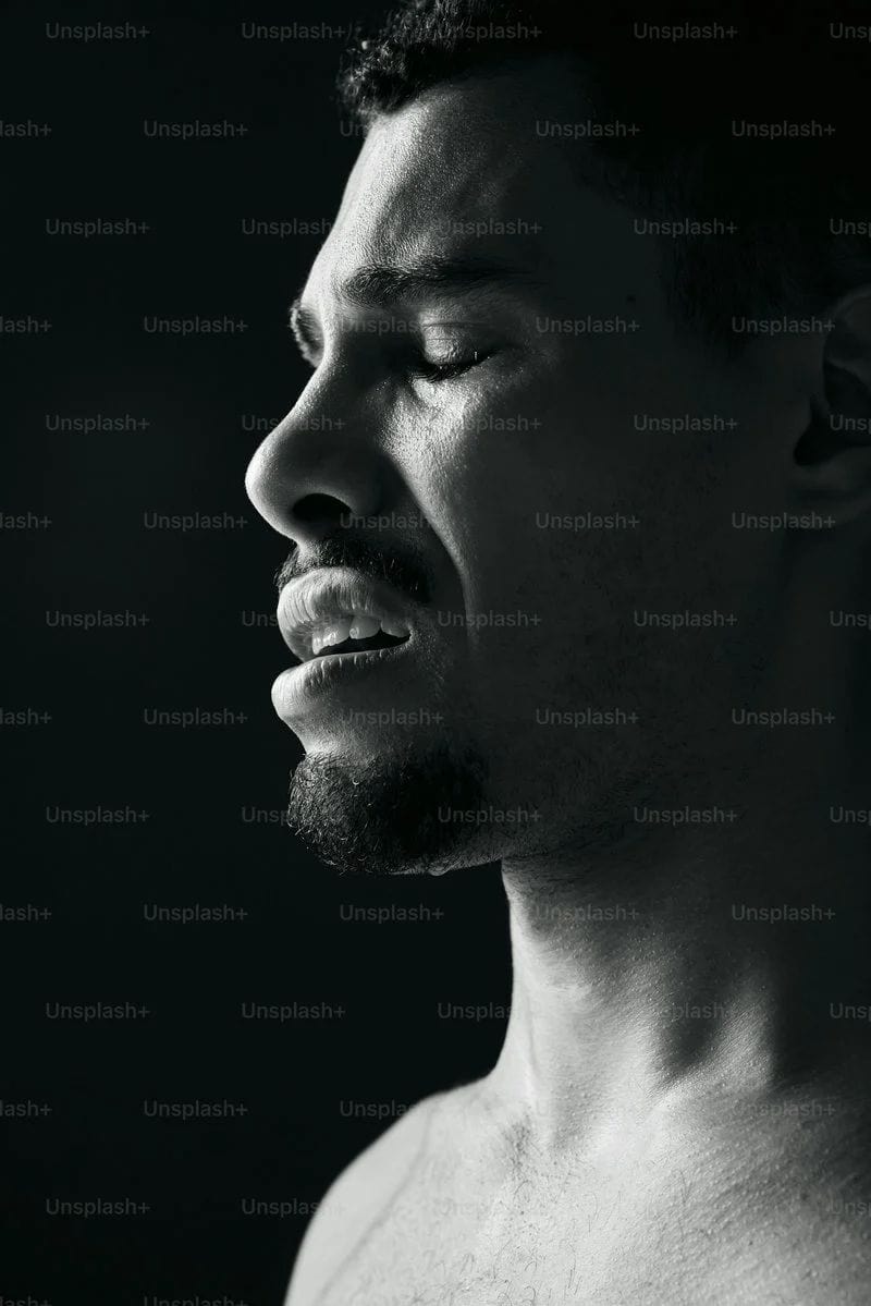A man grimaces with his eyes closed. photo – Sad Image on Unsplash A man grimaces with his eyes closed. photo – Sad Image on Unsplash