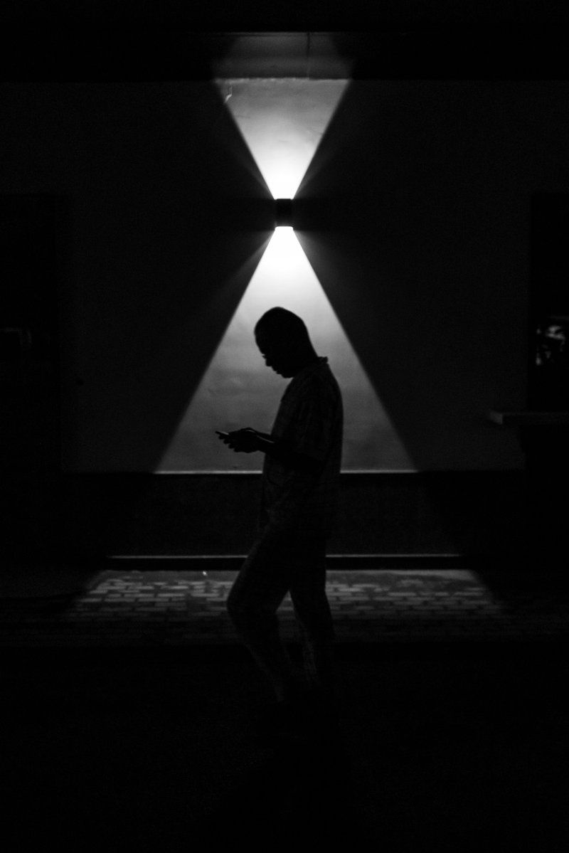 Silhouette of man walking on hallway photo – Free Grey Image ...
