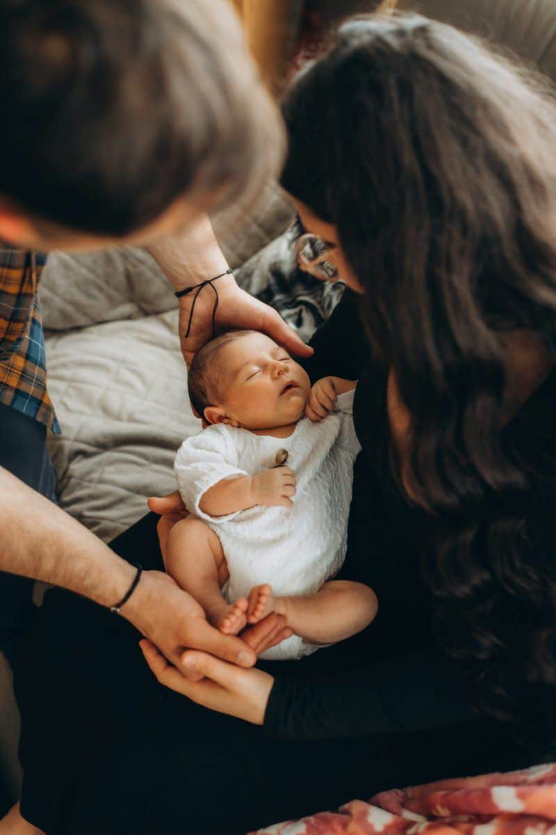 Parents lovingly hold their sleeping newborn baby. photo – Free Portrait Image on Unsplash Parents lovingly hold their sleeping newborn baby. photo – Free Portrait Image on Unsplash