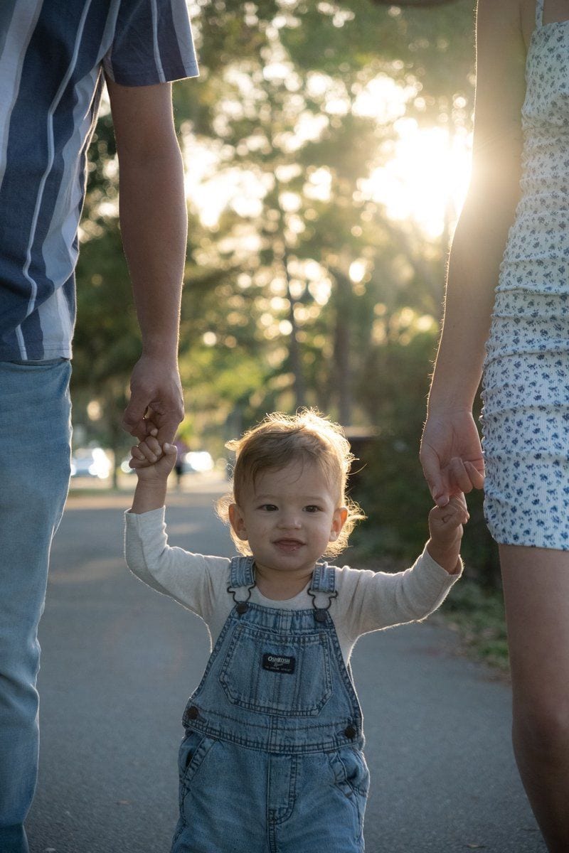 Boy Holding Hands with Mother and Father and Walking at Park · Free Stock Photo Boy Holding Hands with Mother and Father and Walking at Park · Free Stock Photo