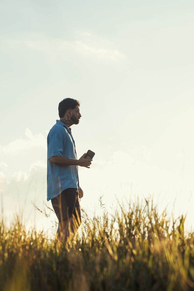 Man Walking in Field at Golden Hour · Free Stock Photo Man Walking in Field at Golden Hour · Free Stock Photo
