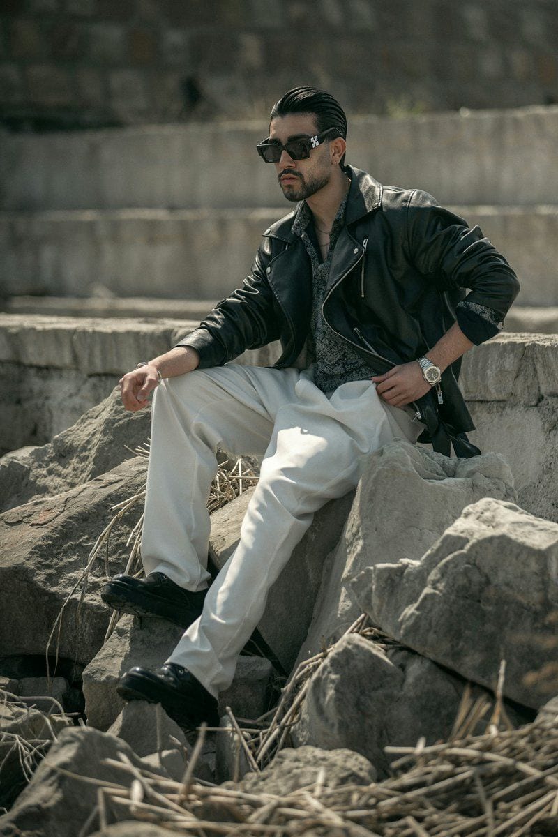 Stylish man poses outdoors, wearing sunglasses and leather jacket - Free Photo on Unsplash Stylish man poses outdoors, wearing sunglasses and leather jacket - Free Photo on Unsplash