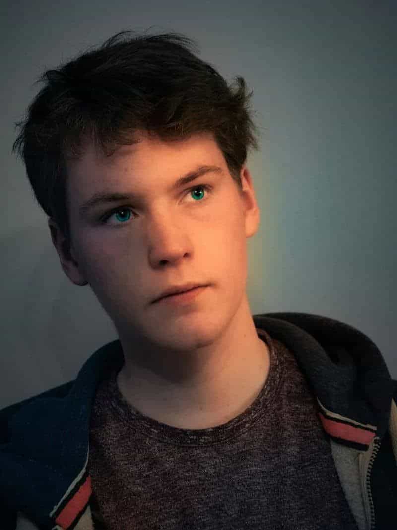 A young man with a serious look on his face photo – Free Face Image on  Unsplash