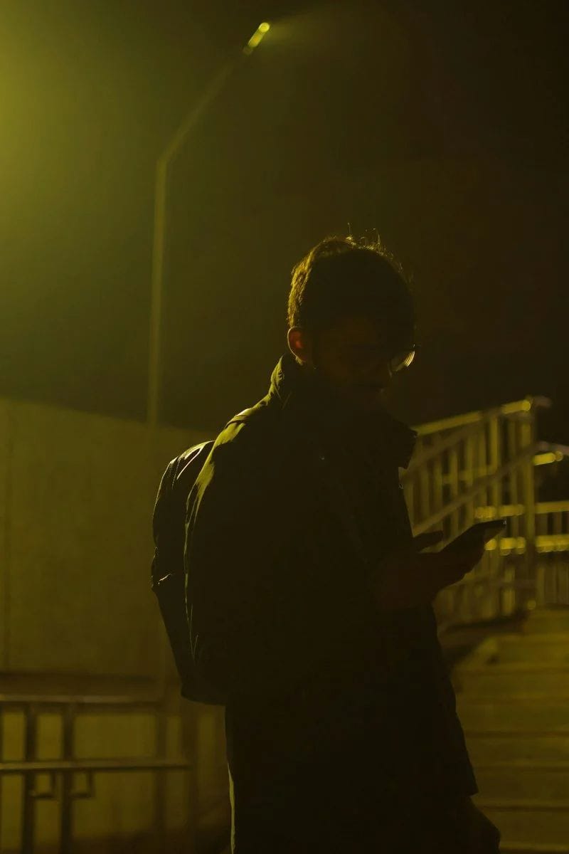 Person looking at phone at night with street light - Free Photo on Unsplash Person looking at phone at night with street light - Free Photo on Unsplash