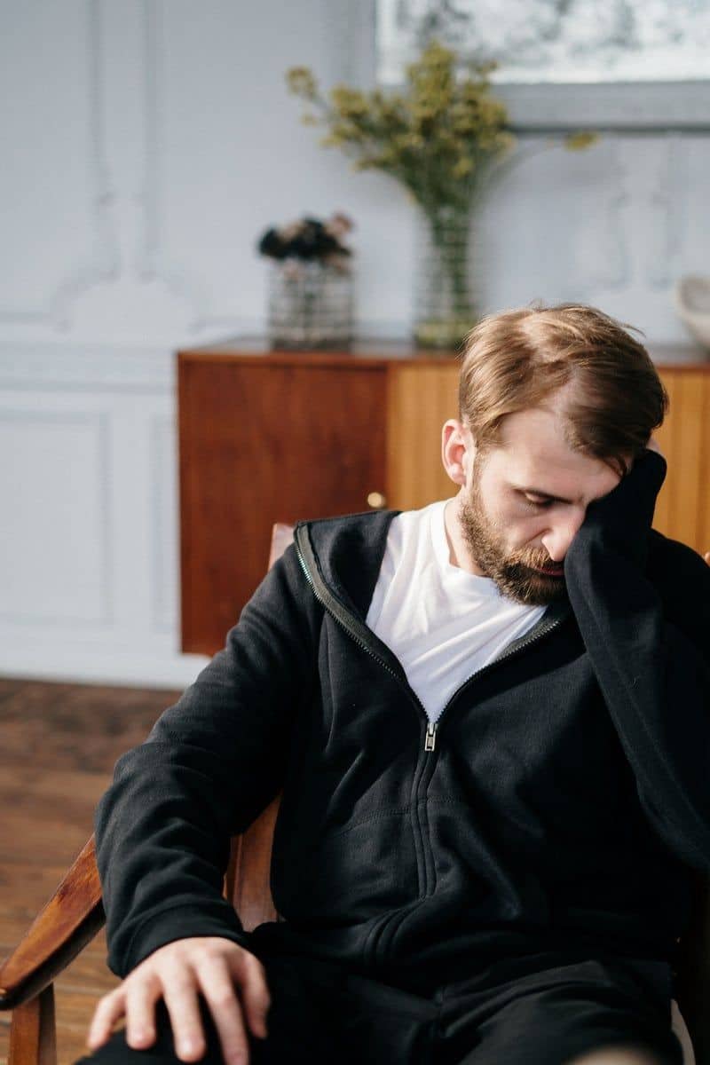 A Distressed Man Sitting on a Couch · Free Stock Photo A Distressed Man Sitting on a Couch · Free Stock Photo